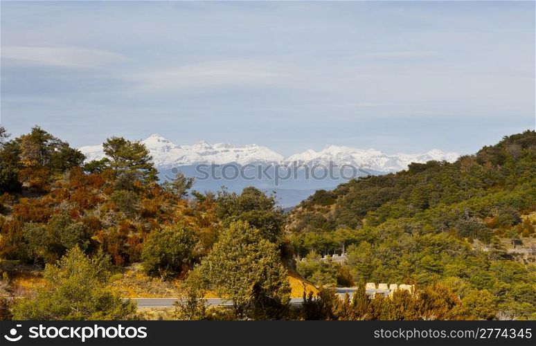 Winding Mountain Road on the Background of Snow-capped Pyrenees
