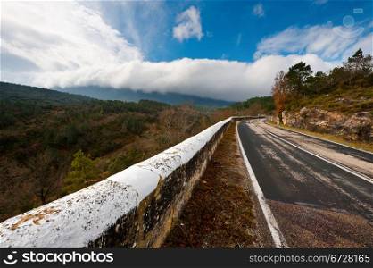 Winding Mountain Road on the Background of Snow-capped Pyrenees