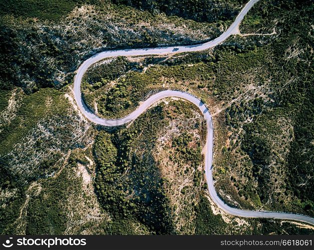 Winding road top aerial view drone shot, Sithonia, Greece