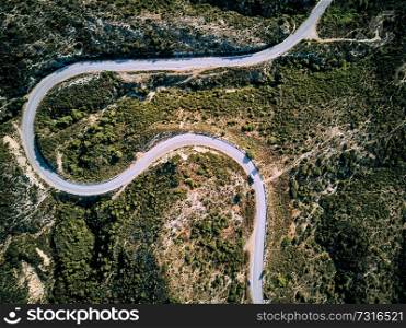 Winding road top aerial view drone shot, Sithonia, Greece