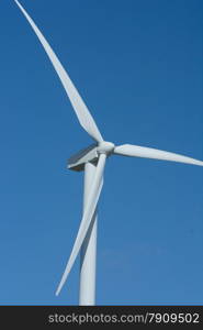 windmill against a bright blue sky