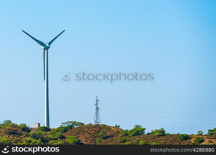 windmill and power line on the hill