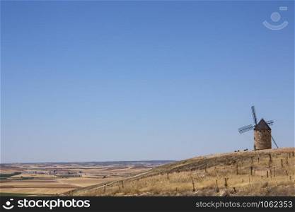 Windmill near the town of Belmonte in the La Mancha region of central Spain - Space for Text.
