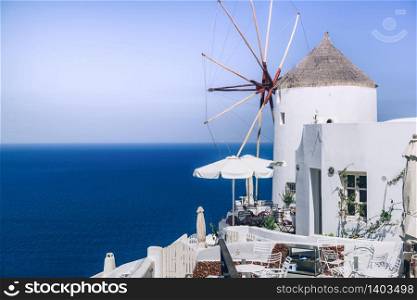 Windmill on Santorini island, Greece, Oia. Aegean sea view. Copy space. Windmill on Santorini Island, Greece