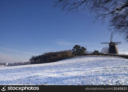 Windmill Op de Vrouweheide. Windmill On the Vrouweheide near the Limburg Ubachsberg in a snowy landscape