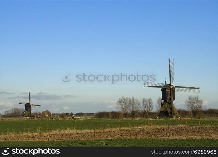 Windmill the Zandwijkse molen near Uppel in the Dutch province Noord-Brabant with the Uitwijkse molen in the background. Windmill the Zandwijkse windmolen