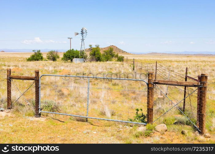 Windmill Windpump on a farm in rural grassland area of South Africa