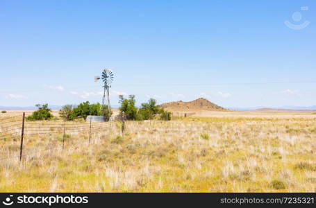 Windmill Windpump on a farm in rural grassland area of South Africa