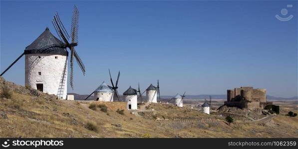 Windmills and castle of Consuegra in the La Mancha region of central Spain.
