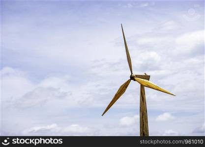 Windmills are made of wood background sky with beautiful clouds.