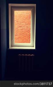 window in the corridor overlooking the bricks
