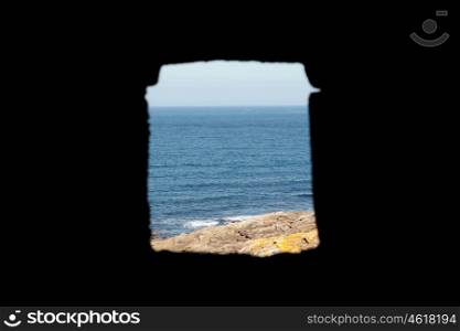 Window of a watchtower overlooking the Atlantic Ocean