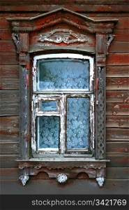 window of very old wooden russian house