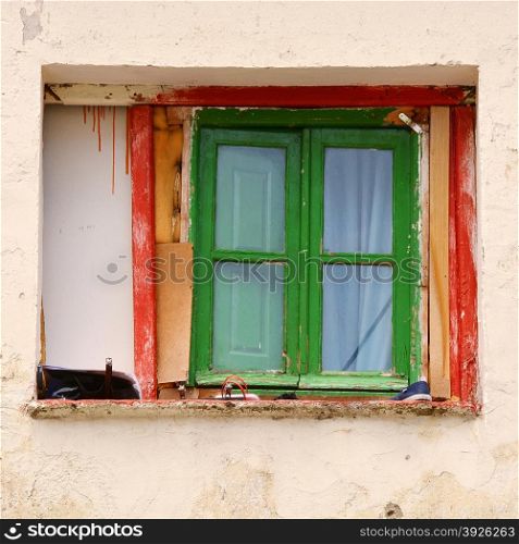 Window on facade of old house in Madrid