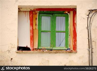 Window on facade of old house in Madrid
