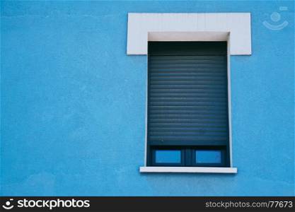 window on the blue building facade in Bilbao city