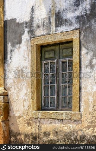 Window on the side of an old church in colonial architecture in the historic city of Ouro Preto in Minas Gerais. Window on the side of an old church in colonial architecture