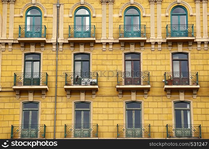 window on the yellow building facade in Bilbao city