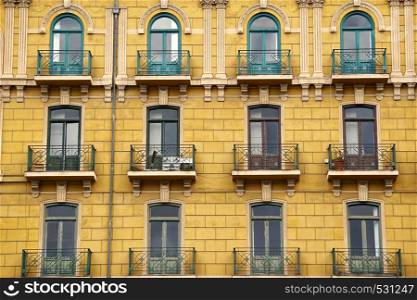 window on the yellow building facade in Bilbao city