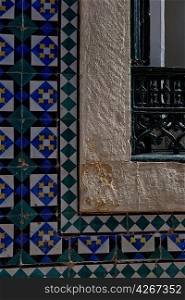 Window surrounded with mosaic tiles