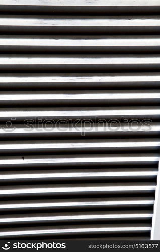 window varese palaces italy abstract sunny day wood venetian blind in the concrete brick besnate