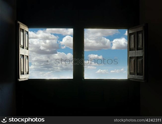 Window view and blue cloudy sky. Two opened windows