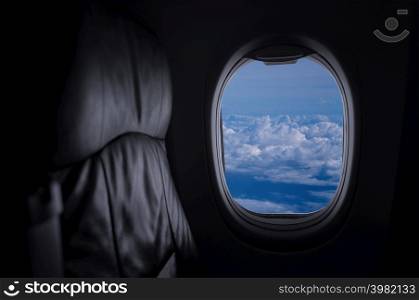 Window View From Passenger Seat On Commercial Airplane with blue sky, Concept of travel and air transportation.. Travel and transportation concept
