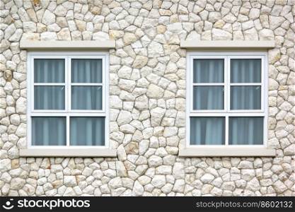 window with curtain on stone wall background