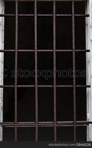 Window with iron bars for protection of an old building