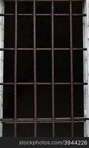 Window with iron bars for protection of an old building