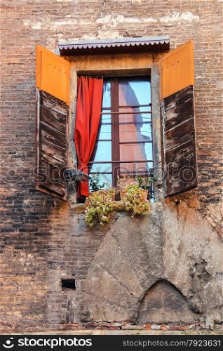 Window with shutters in old Italian house