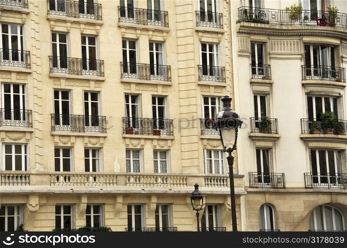 Windows and balconies of old apartment buildings in Paris France