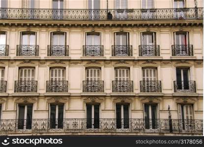 Windows and balconies of old apartment buildings in Paris France