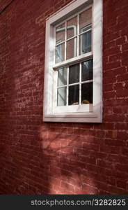 Windows and brick exterior of a building in the Hamptons