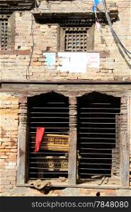 Windows and brick wall of house in Bhaktapur, Nepal