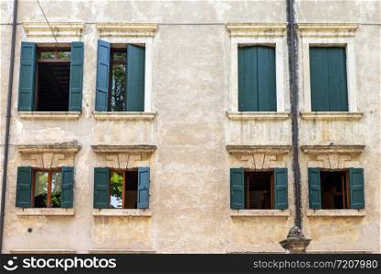 windows in the facades of ancient Venetian houses