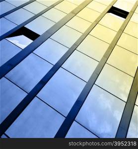 Windows of office building and sky reflection