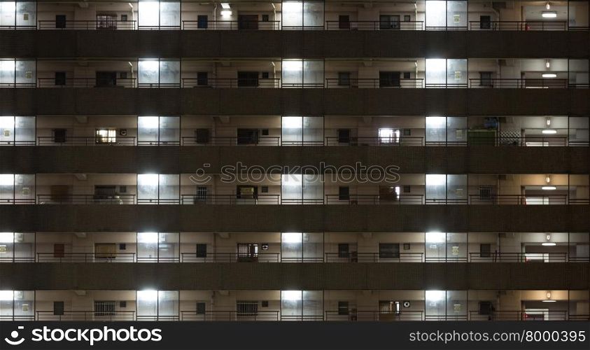 windows of office buildings background at night