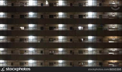 windows of office buildings background at night