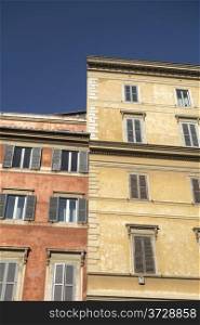 Windows of old buildings in Rome