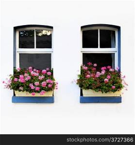 Windows of old house with flowers, Germany