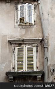 Windows on the wall of house in Shibenik, Croatia