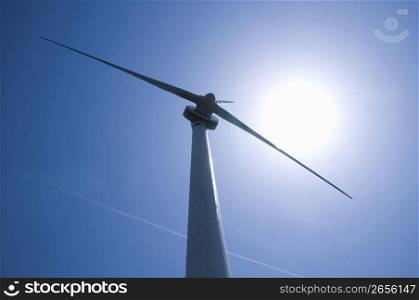 Windpower high up in a blue sky