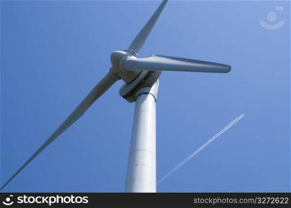 Windpower high up in a blue sky