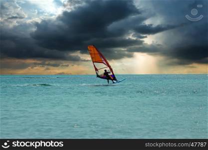 Windsurfer at Aruba island on the Caribbean Sea at a beautiful sunset