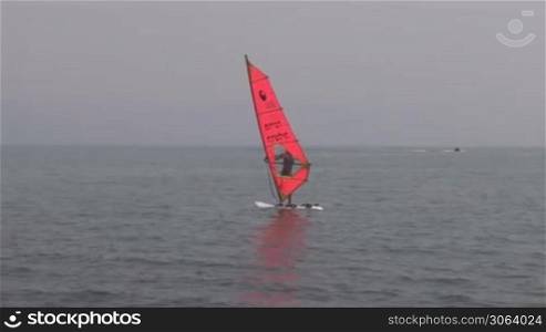 windsurfer floating in the sea