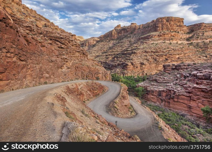 windy road in Canyonlands near Moab, Utah, descending into a canyon