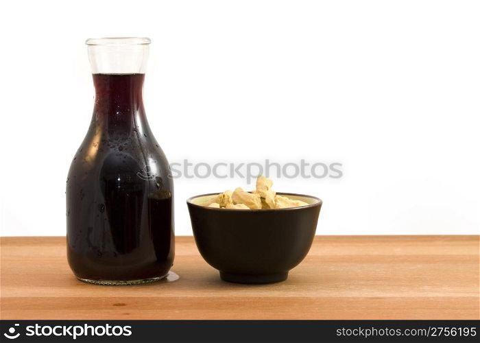wine and bagels. photo of a bottle of red wine and a cup of dry bagels