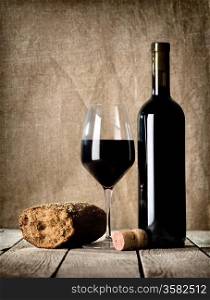 Wine and bread on the wooden table