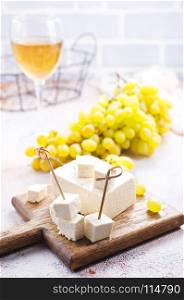 wine and cheese on a table, stock photo